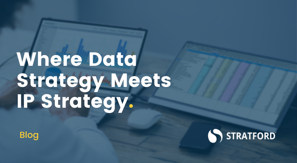 Person comparing analytics and spreadsheets on different tablets with text overlay "Where Data Strategy Meets IP Strategy."